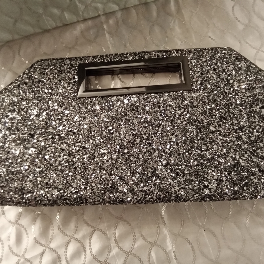 Preloved but excellent condition clutch Express silver glitter